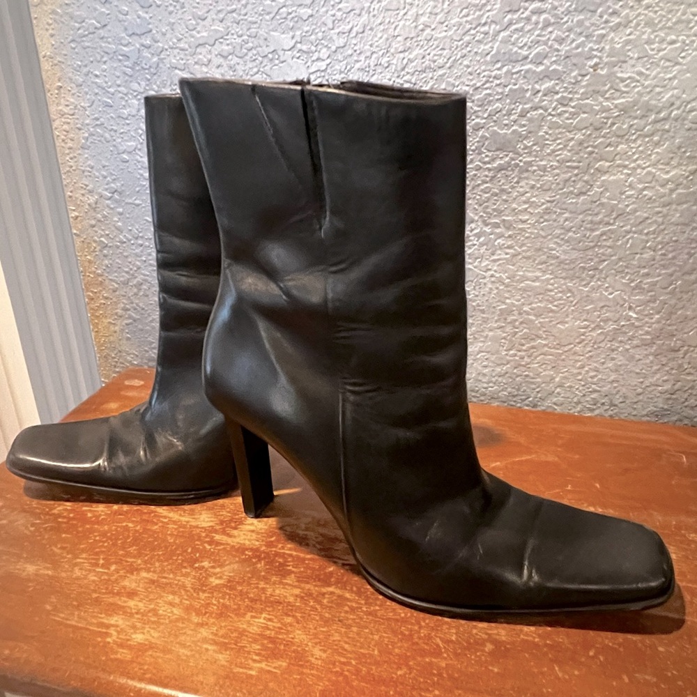 Black leather zip heeled boots